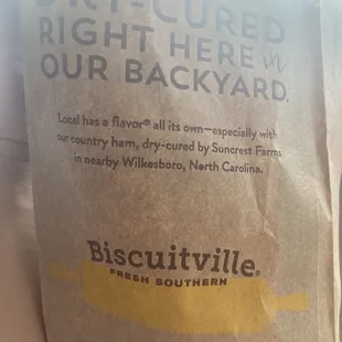a brown bag of biscuitville biscuits