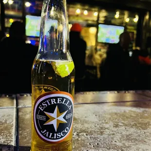 a bottle of beer on a table