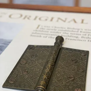 Original door hinge, which has been used in the Kāhili Room for a century