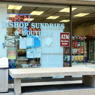 a bench in front of a store