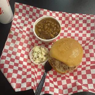 pulled pork sandwhich, coleslaw, baked beans
