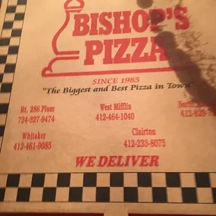 a pizza box with a slice taken out of it