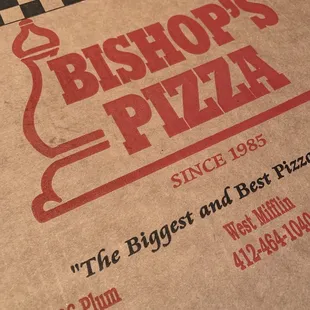 a closeup of a pizza box