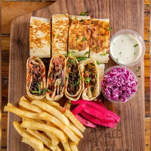 a wooden cutting board with a variety of food items