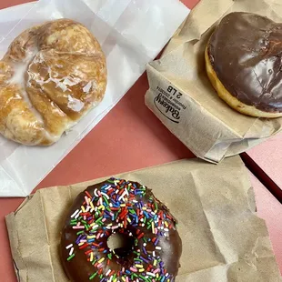 two donuts with chocolate frosting and sprinkles