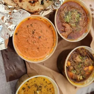 Butter chicken, lamb korma, beef Karahi and tilapia curry.