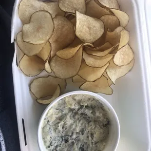 Amazing spinach artichoke dip with handmade potato chips. Delicious!