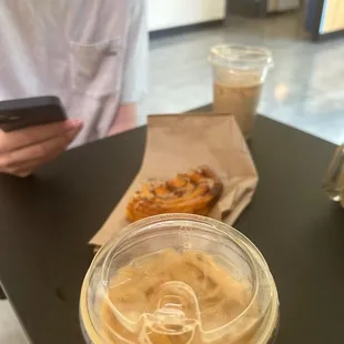 Ice vanilla latte with oatmilk and cinnamon bun