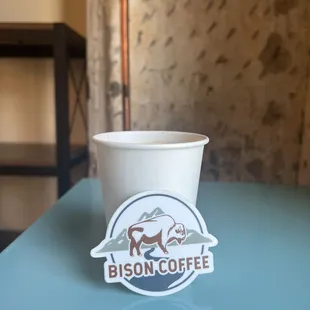 a cup of coffee on a table