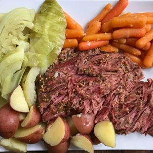 corned beef, potatoes, carrots, and lettuce