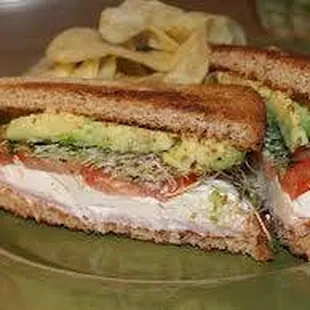 The C.A.B.!  Oven baked chicken breast combined with avocado slices, alfalfa sprouts, bacon and our secret Russian mustard drizzled on top!