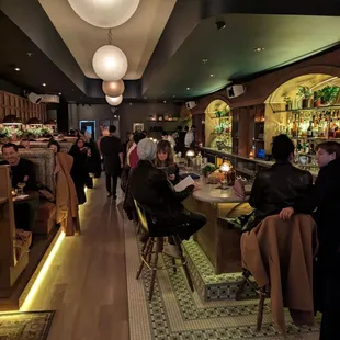 people sitting at tables in a restaurant