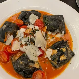 Lobster ravioli with squid ink pasta