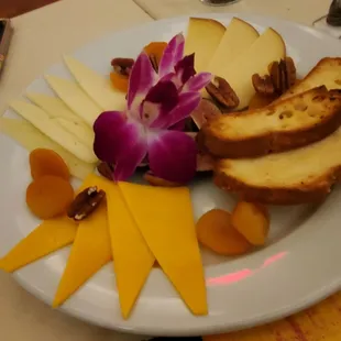 $22  Dried apricots,  pecans, fresh figs, cheddar cheese, machengo cheese, smoked mozarrella,  crostini