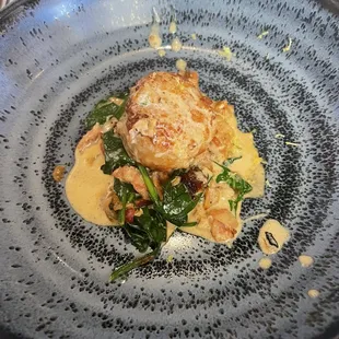 Scallop with spinach.