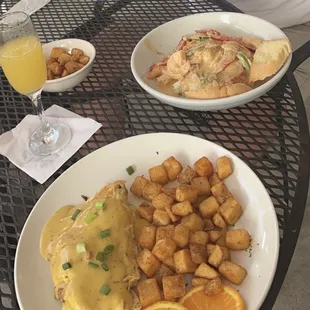 Olde Town Creole Omelette with Hashbrowns (bottom) and Shrimp & Grits (top).