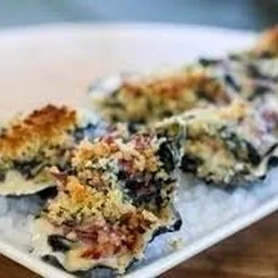 three oysters on a plate