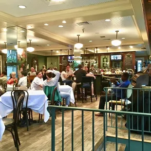 people sitting at tables in a restaurant