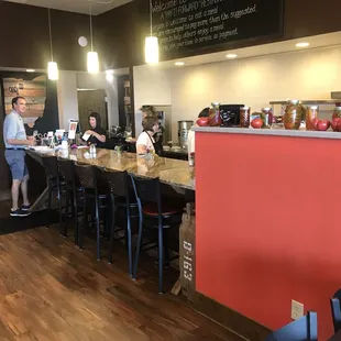 customers at the counter of a restaurant