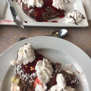 One order of red velvet pancakes split in two. YUM