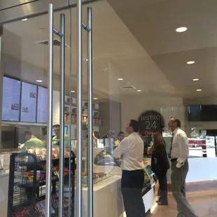 a man and a woman standing in front of a counter