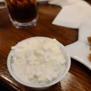 a bowl of cottage cheese and a plate of waffles