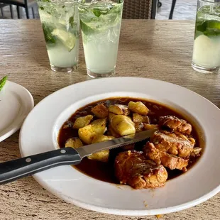 a plate of food and a glass of water