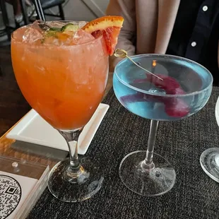 two cocktails on a table