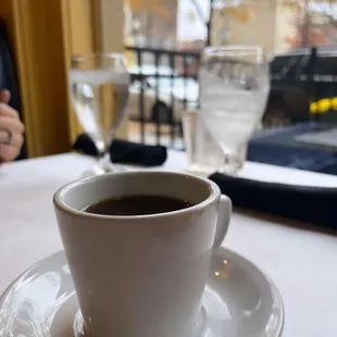 a cup of coffee on a saucer