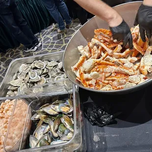 a bowl of seafood being prepared