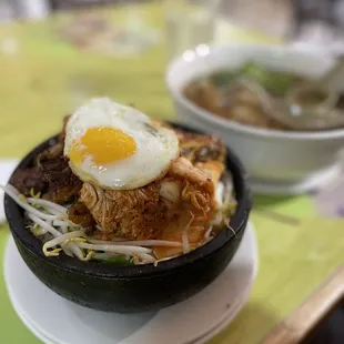 #550. Com Nieu Suon Bo Dai Han Burning hot stone pot. Ask for an extra plate.