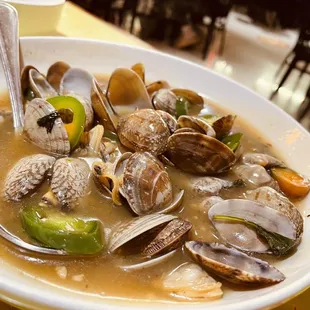 a bowl of clams and peppers