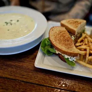 bowl of clam chowder and Dungeness Crab sandwich