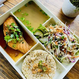 a plate of food with rice and vegetables