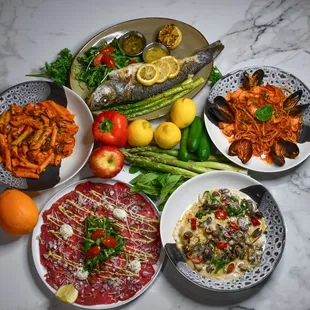 Penne with Chicken, Whole Branzino, Seafood Linguini, Beef Carpaccio, Truffle Mushroom Ravioli