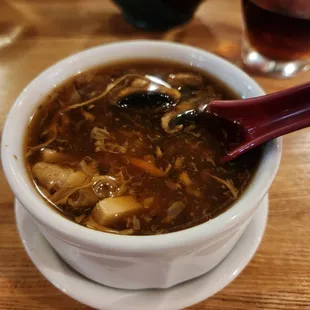 a bowl of soup with a spoon in it