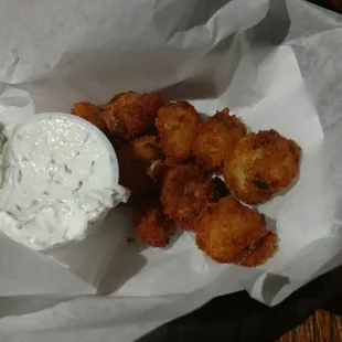 This are quarter sized. My friend paid $5 for quarter sized balls of what tasted like soggy fried potatoes?