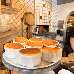 What looked like some sort of dessert but possibly savory soufflé or something that were right next to the pizza oven station