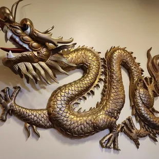 the head of a dragon on a wall