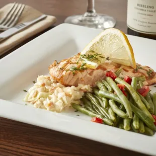 a plate of food and a glass of wine