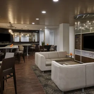 a modern living room with a bar