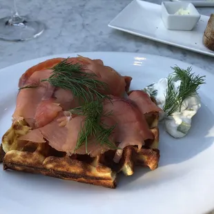 Smoked salmon on potato waffle with dill crème fraiche