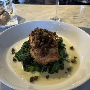 Gremolata crusted ling cod with sautéed spinach, brown butter shallots, and fried capers.