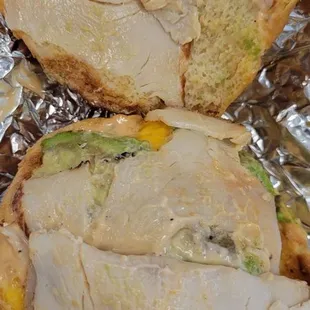 Sauce everywhere on the sandwich top and bottom