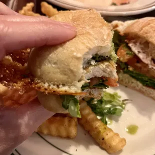 Crispy lacey cheesy goodness on pesto chicken sandwich