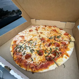 Remake of the burnt pizza- pepperoni, extra cheese and basil on half.