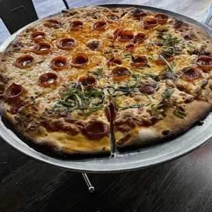 Pepperoni, extra cheese with fresh basil on half.