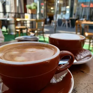 two cups of coffee on a table