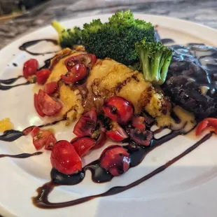 Grilled, marinated Portobello mushrooms over polenta, with a balsamic drizzle.