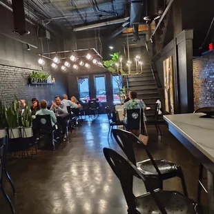 people sitting at tables in a restaurant